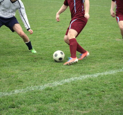 player turns on the ball in football match skills